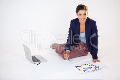 Businesswoman preparing a chart with icons