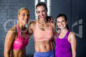 Smiling female athletes in gym