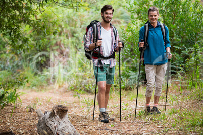 Portrait of hiker couple standing with hiking pole