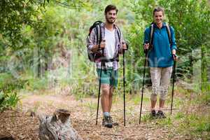 Portrait of hiker couple standing with hiking pole
