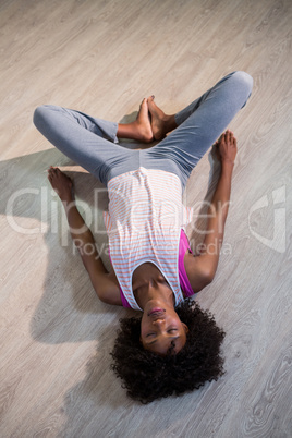 Woman in yoga corpse pose