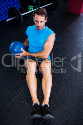 High angle view of male athlete holding ball