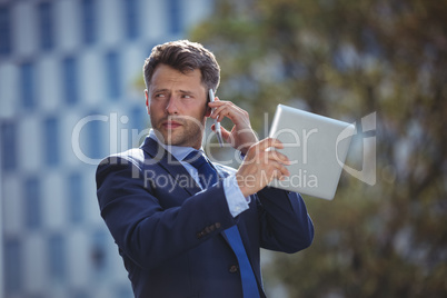 Businessman talking on mobile phone