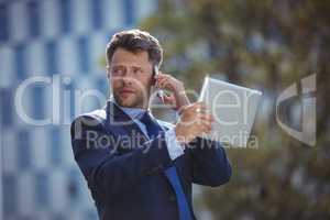 Businessman talking on mobile phone