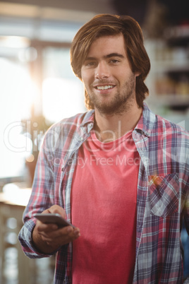 Portrait of man using mobile phone