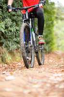 Male cyclist cycling in countryside