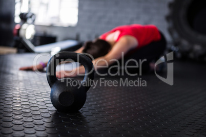 Athlete exercising by kettlebell