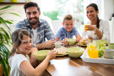 Portrait of family having breakfast