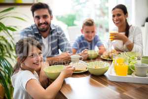 Portrait of family having breakfast