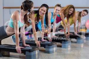 Group of women exercising on aerobic stepper