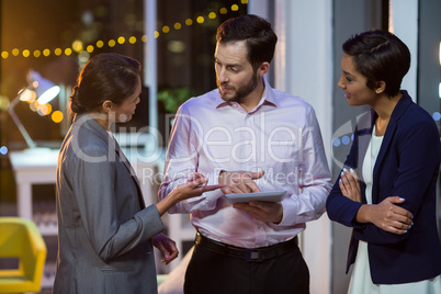 Businesspeople using digital tablet