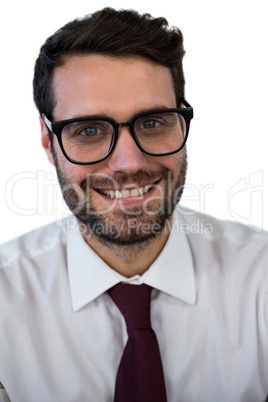 Confidence businessman smiling against white background