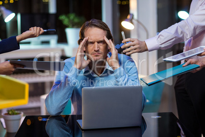 Frustrated businessman sitting in office