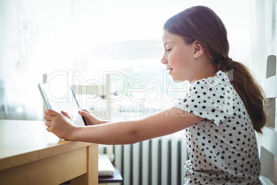 Girl using digital tablet