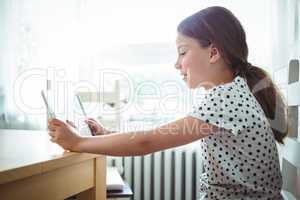 Girl using digital tablet