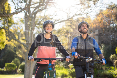 Biker couple cycling in countryside