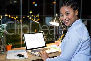 Businesswoman working on laptop