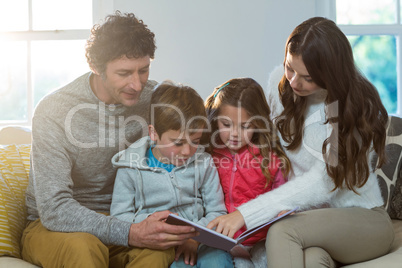 Family reading a book