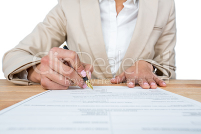 Mid section of businesswoman filling mortgage contract form