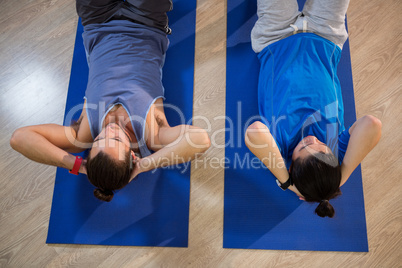 Men exercising on exercise mat