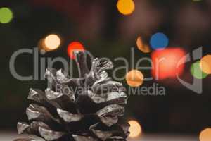 Close-up of pine cone on wooden table