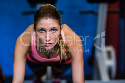 Determined female athlete doing push-ups