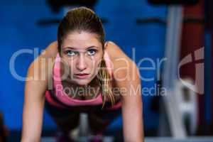 Determined female athlete doing push-ups