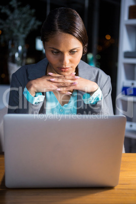 Businesswoman working on laptop