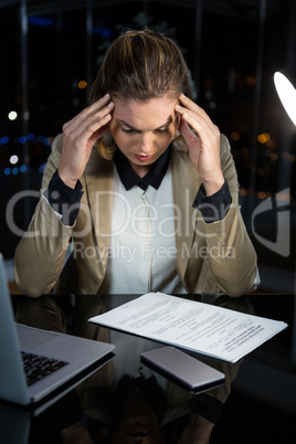 Frustrated businesswoman working in office