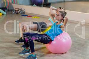 Two women exercising on exercise ball