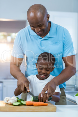 Father and son preparing food