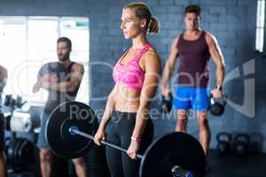 Female athlete holding barbell