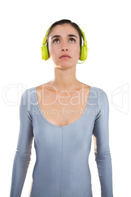 Woman in exercise outfit wearing headphones
