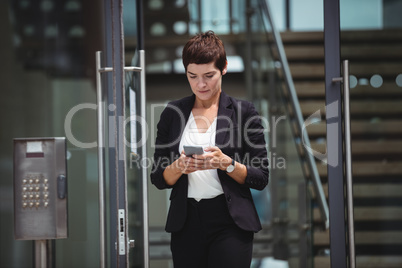 Businesswoman using mobile phone