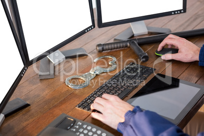 Hands of security officer using computer