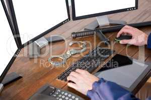 Hands of security officer using computer