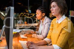 Businesswomen working on computer at their desk