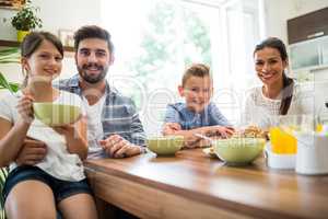 Portrait of family having breakfast