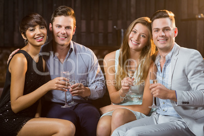 Two smiling couple having glasses of champagne