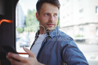 Handsome man travelling in bus