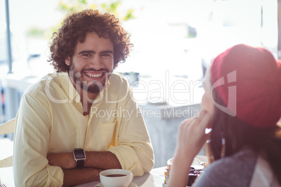 Portrait of smiling man having cup of coffee