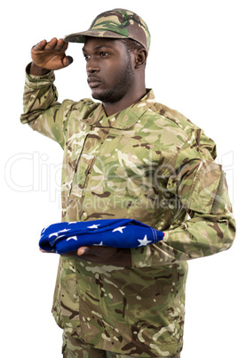 Portrait of soldier holding an american flag and saluting