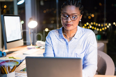 Businesswoman working on laptop