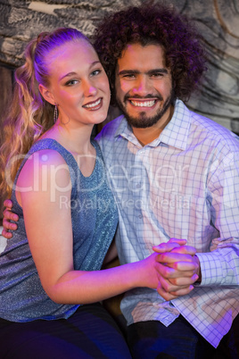 Romantic couple sitting together in bar