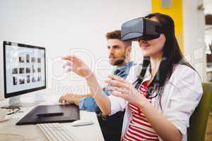 Executive enjoying augmented reality headset at creative office