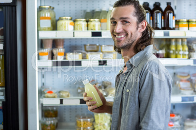 Portrait of happy man shopping for groceries