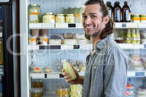 Portrait of happy man shopping for groceries