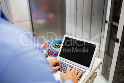 Technician using laptop