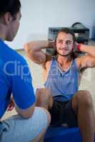 Fitness man talking to instructor