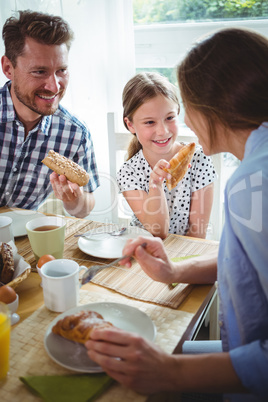 Happy family having breakfast